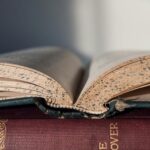 Vintage open book showing worn pages, close-up view. Ideal for literature and education themes.