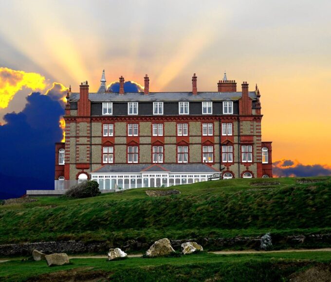 A stunning hotel exterior during sunset, located in Newquay, Cornwall.