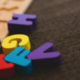 alphabet learning toy on gray apparel