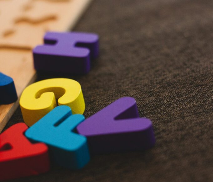 alphabet learning toy on gray apparel