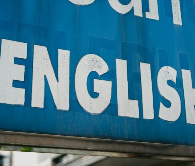 a close up of a blue sign with white lettering