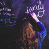 unknown person writing on chalkboard