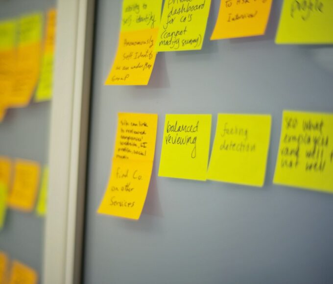 selective focus photography of yellow and orange post-it notes on wall