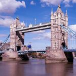 gray concrete bridge under blue sky during daytime